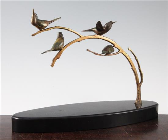 A 1920s French patinated bronze group of four birds upon a branch, L.14in.